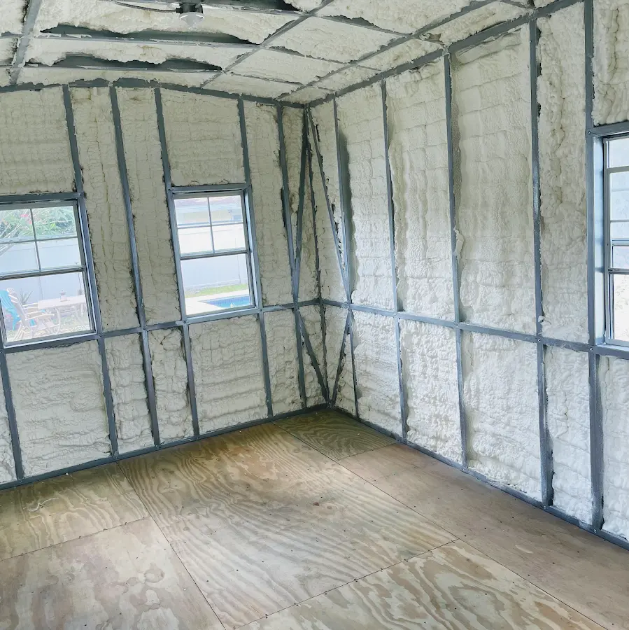 Closed-cell spray foam insulation applied to wall cavities in a residential project in Newport